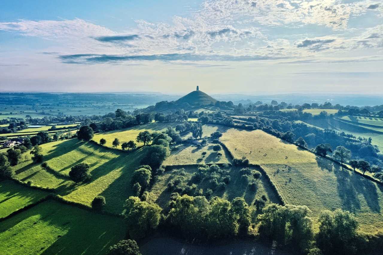 Glastonbury Tor surrounded by the Somerset Levels.